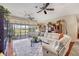 Spacious living room with comfortable seating and a view of the outdoor lanai at 6242 Tropicaire Blvd, North Port, FL 34291