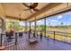 Relaxing screened patio with comfortable seating and scenic views of the pond at 6242 Tropicaire Blvd, North Port, FL 34291