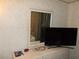 Simple bedroom setup with a modern TV and dresser, designed for functionality at 6832 Holo Ct, North Port, FL 34287