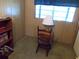 Bedroom featuring a window with a chair and lamp at 6832 Holo Ct, North Port, FL 34287