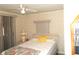Relaxing bedroom with a comfortable bed, soft lighting, and sliding-door access to the exterior at 6832 Holo Ct, North Port, FL 34287