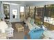 Bright lanai featuring comfortable seating, glass top table, and lots of natural light through the many windows at 6832 Holo Ct, North Port, FL 34287