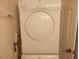 Laundry room featuring a stacked washer and dryer at 6832 Holo Ct, North Port, FL 34287