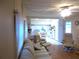 The open-concept living area seamlessly flows into the kitchen with modern furniture at 6832 Holo Ct, North Port, FL 34287
