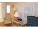 The living room features neutral walls, a floor lamp, and a cozy chair at 6832 Holo Ct, North Port, FL 34287