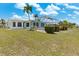 Expansive backyard with screened enclosure, offering a private and serene outdoor space for relaxation at 732 Santa Margerita Ln, Punta Gorda, FL 33950