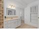 Bathroom vanity features modern fixtures, a neutral color palette, and unique tile accents at 732 Santa Margerita Ln, Punta Gorda, FL 33950