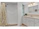 Bathroom with shower features modern fixtures, a neutral color palette, and unique tile accents at 732 Santa Margerita Ln, Punta Gorda, FL 33950