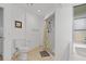 Bathroom with shower features modern fixtures, a neutral color palette, and unique tile accents at 732 Santa Margerita Ln, Punta Gorda, FL 33950