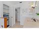 Bathroom featuring ample cabinet space, vanity, and decorative wall paneling at 732 Santa Margerita Ln, Punta Gorda, FL 33950