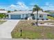Charming single-story home with a well-maintained front yard and a two-car garage at 732 Santa Margerita Ln, Punta Gorda, FL 33950