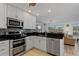 Updated kitchen with stainless steel appliances, granite countertops, and a double oven at 732 Santa Margerita Ln, Punta Gorda, FL 33950