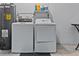 Functional laundry area with washer, dryer, and water heater, ensuring convenience for everyday living at 732 Santa Margerita Ln, Punta Gorda, FL 33950
