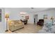 Inviting living area featuring hardwood floors, with an easy flow into the dining room at 732 Santa Margerita Ln, Punta Gorda, FL 33950