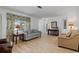 Bright and inviting living room with neutral colors, light wood floors, and comfortable seating at 732 Santa Margerita Ln, Punta Gorda, FL 33950