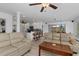 Open-concept living space featuring comfortable seating and seamless flow to the kitchen and dining area at 732 Santa Margerita Ln, Punta Gorda, FL 33950