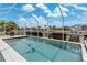 Sparkling screened-in pool with views of the canal at 732 Santa Margerita Ln, Punta Gorda, FL 33950