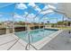 Outdoor pool with a screened enclosure surrounded by sunny landscaping at 732 Santa Margerita Ln, Punta Gorda, FL 33950