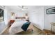 Bedroom with wood-look tile flooring, a ceiling fan, and a cozy bed with decorative pillows at 809 Kings Ct, Punta Gorda, FL 33950
