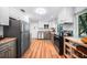 Well-lit kitchen featuring stainless steel appliances, granite countertops, and ample cabinet space at 809 Kings Ct, Punta Gorda, FL 33950
