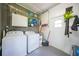 Functional laundry room with washer, dryer, storage cabinets, and a utility sink at 809 Kings Ct, Punta Gorda, FL 33950