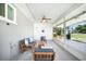 Relaxing sunroom with ceiling fan, comfortable seating, and clear views of the backyard at 809 Kings Ct, Punta Gorda, FL 33950