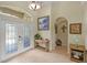 Foyer featuring tile flooring, console table, and an arched doorway at 13297 Flaherty Ave, Port Charlotte, FL 33981