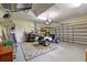 Spacious garage with a golf cart, ample storage, and an overhead garage door at 13297 Flaherty Ave, Port Charlotte, FL 33981