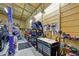 Garage interior showcasing ample space, with tool storage and work areas, perfect for car enthusiasts and DIY projects at 13297 Flaherty Ave, Port Charlotte, FL 33981