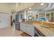 Open kitchen with granite countertops and stainless steel appliances, flowing into the living area at 13297 Flaherty Ave, Port Charlotte, FL 33981