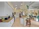 Open kitchen with granite countertops, white cabinets, and barstool seating at 13297 Flaherty Ave, Port Charlotte, FL 33981