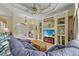 Living room featuring an oversized sofa, custom shelving, and a large window at 13297 Flaherty Ave, Port Charlotte, FL 33981