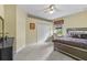 Comfortable bedroom with a large bed, closet, and a dedicated desk space by the window at 13297 Flaherty Ave, Port Charlotte, FL 33981