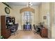 Bright office featuring two work stations, large window, and neutral decor at 13297 Flaherty Ave, Port Charlotte, FL 33981