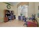 Office space featuring dual desks, neutral tones and a window with decorative drapery at 13297 Flaherty Ave, Port Charlotte, FL 33981