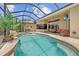 Beautiful screened-in pool with a spa and a spacious deck, providing an ideal retreat for relaxation and recreation at 13297 Flaherty Ave, Port Charlotte, FL 33981