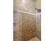 Tiled shower with handheld shower head and recessed shelving at 13297 Flaherty Ave, Port Charlotte, FL 33981