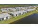 Aerial view of the property, featuring lush landscaping and serene water views at 14267 Heritage Landing Blvd # 1223, Punta Gorda, FL 33955