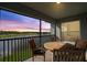 Outdoor seating on this balcony offering beautiful sunset lake views at 14267 Heritage Landing Blvd # 1223, Punta Gorda, FL 33955