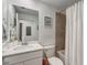Well-lit bathroom with a vanity, framed mirror, and shower featuring a white shower curtain at 14267 Heritage Landing Blvd # 1223, Punta Gorda, FL 33955