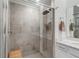 Nicely tiled shower with glass door, shower head, and built-in bench at 14267 Heritage Landing Blvd # 1223, Punta Gorda, FL 33955
