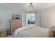 Bedroom features dresser with TV and door opening to the next room at 14267 Heritage Landing Blvd # 1223, Punta Gorda, FL 33955