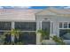 Close up of exterior features, screen lanai, stairs, and decorative columns at 14267 Heritage Landing Blvd # 1223, Punta Gorda, FL 33955