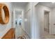Hallway with decorative mirror and access to bathroom and living areas at 14267 Heritage Landing Blvd # 1223, Punta Gorda, FL 33955