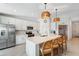 Well-lit kitchen features a large quartz island, stainless steel appliances, and stylish pendant lighting at 14267 Heritage Landing Blvd # 1223, Punta Gorda, FL 33955