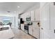 Bright kitchen with stainless steel appliances and white cabinetry adjoins a cozy dining nook at 14267 Heritage Landing Blvd # 1223, Punta Gorda, FL 33955
