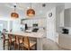 Contemporary kitchen features a quartz island with seating and views to the adjacent dining area at 14267 Heritage Landing Blvd # 1223, Punta Gorda, FL 33955
