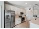 Modern kitchen with stainless steel appliances and white cabinetry, and a large quartz countertop at 14267 Heritage Landing Blvd # 1223, Punta Gorda, FL 33955