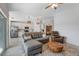 Bright, open-concept living room features modern furnishings and seamless flow into a sleek, white kitchen at 14267 Heritage Landing Blvd # 1223, Punta Gorda, FL 33955