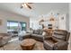 Inviting living room boasting a comfortable seating area, an adjacent outdoor patio, and an airy kitchen at 14267 Heritage Landing Blvd # 1223, Punta Gorda, FL 33955
